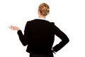 Back view of business woman shrugging with I dont know gesture