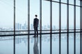 Back view of businessman looking out of window Royalty Free Stock Photo