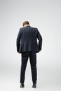 Back view of businessman marionette in