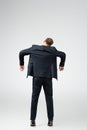 Back view of businessman marionette in