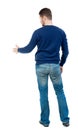 Back view of businessman reaches out to shake hands. Royalty Free Stock Photo