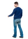 Back view of businessman reaches out to shake hands. Royalty Free Stock Photo