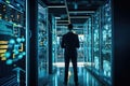 Back view of businessman standing in server room and looking at big data, Administrator Working With Data Protection Engineering