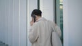 Back view businesswoman calling phone walking near office building. Girl talking Royalty Free Stock Photo