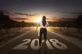 Back view of businesswoman running on the street with 2018 numbe Royalty Free Stock Photo