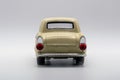 Classic, cream-colored, miniature car model