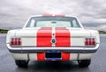 Back view of a classic Ford Mustang 1965 on display at a classic car meeting