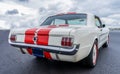 Back view of a Ford Mustang 1965 on display at a classic car meeting in Rotterdam, Netherlands