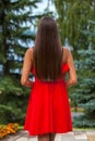 Back view close up portrait young beautiful brunette woman in red dress Royalty Free Stock Photo