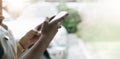 Back view close up of a woman hand using a smart phone with blank screen lying on a couch at home Royalty Free Stock Photo