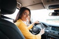 Back view of a confident smiling woman driving car Royalty Free Stock Photo