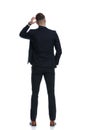 Back view of confused businessman scratching his head Royalty Free Stock Photo