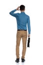 Back view of confused young man scratching head Royalty Free Stock Photo