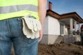 Back view of constructor pocket with gloves Royalty Free Stock Photo