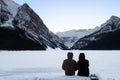 Back view of a couple admiring the Lake Louise, Canada Royalty Free Stock Photo