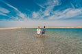 Back view of couple posing at lake in desert of Ras Mohammed National Park. Egypt