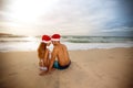 Back view of couple with Santa hats Royalty Free Stock Photo
