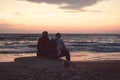 Back view of a couple silhouette watching sun Royalty Free Stock Photo