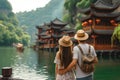 Back view of a couple of travelers admiring a view of spectacular Chinese landscape. Vacation in China