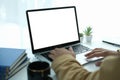 Back view creative man working with laptop computer while sitting in modern office Royalty Free Stock Photo