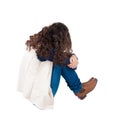 Back view curly girl sitting and crying. Royalty Free Stock Photo