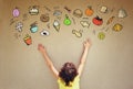 Back view of cute kid imagine various foods with set of infographics over textured wall background Royalty Free Stock Photo