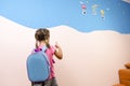 Back view, cute little girl with pigtails and backpack Royalty Free Stock Photo