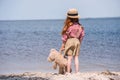 Child with teddy bear at seashore Royalty Free Stock Photo