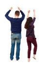 Back view of dancing young couple men and women . Dance party. Royalty Free Stock Photo