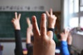 Classroom students hands raised
