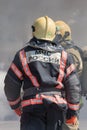 Back view with emblem Emercom of Russia on uniform firefighters of Ministry of Civil Defence, Emergencies and Disaster