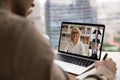 Back view of employee have webcam team meeting with colleagues Royalty Free Stock Photo