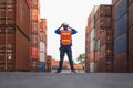 Back view of engineer in safety gear, Foreman walking in industry containers cargo, Dock worker in hard hat at shipping container Royalty Free Stock Photo