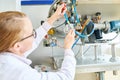 Female Technician Making Adjustments Royalty Free Stock Photo