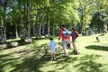 Back view of family walking in forest Royalty Free Stock Photo