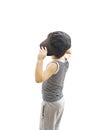 Back view of fashionable little boy.Hip-Hop Style looking at wall. Royalty Free Stock Photo