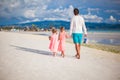 Back view of father and two girls walking on Royalty Free Stock Photo