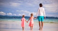 Back view of father and two girls walking on Royalty Free Stock Photo