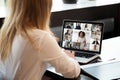 Back view of female employee have video call on laptop Royalty Free Stock Photo