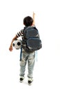 Back view Full length of young school boy holding a football, pointing at blank copy space Royalty Free Stock Photo