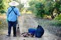 Sweep dry leaves to make compost. Environment protection Royalty Free Stock Photo