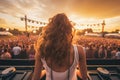 Back view of a girl dancing in front of the crowd at a music festival Royalty Free Stock Photo