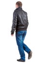 Back view of going handsome man in jacket Royalty Free Stock Photo