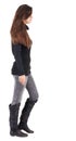 Back view of going woman in jeans and sweater Royalty Free Stock Photo