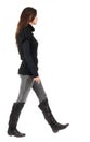 Back view of going woman in jeans and sweater Royalty Free Stock Photo