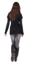 Back view of going woman in jeans and sweater Royalty Free Stock Photo