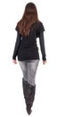 Back view of going woman in jeans and sweater Royalty Free Stock Photo