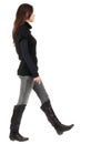 Back view of going woman in jeans and sweater Royalty Free Stock Photo