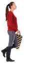 Back view of going woman with shopping bags. Royalty Free Stock Photo