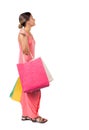 Back view of going woman with shopping bags . beautiful girl i Royalty Free Stock Photo